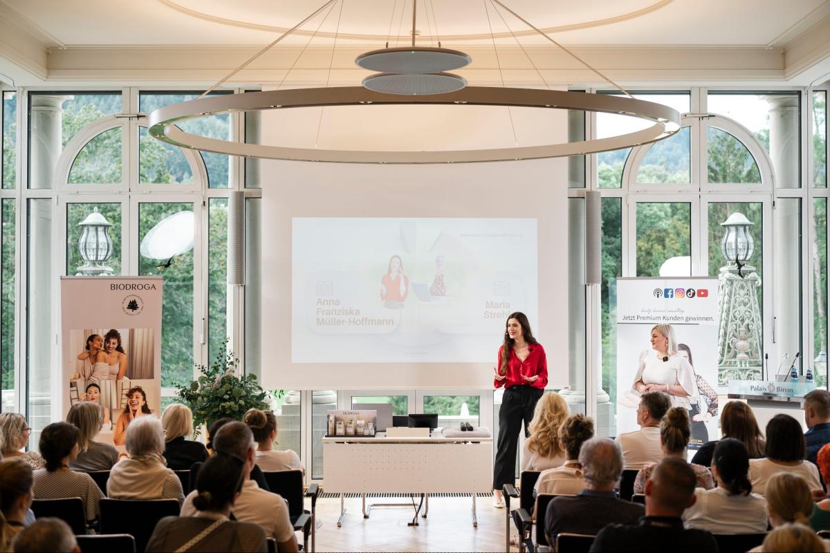 Präsentation von Beauty Business Consulting während einer Veranstaltung.